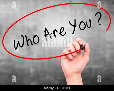 Man Hand writing Who Are You with black marker on visual screen Stock Photo