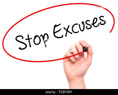 Man Hand writing  Stop Excuses  with black marker on visual screen Stock Photo