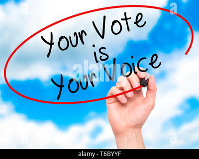 Man Hand writing Your Vote is Your Voice with black marker on visual screen Stock Photo