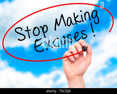 Man Hand writing Stop Making Excuses with black marker on visual screen Stock Photo