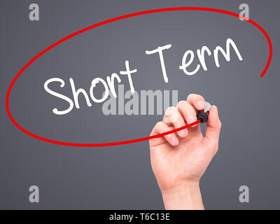 Man Hand writing Short Term with black marker on visual screen Stock Photo