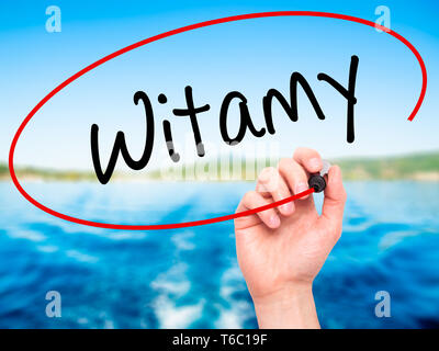 Man Hand writing Witamy (Welcome in Polish) with black marker on visual screen. Stock Photo