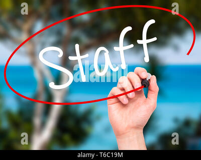 Man Hand writing  Staff with black marker on visual screen Stock Photo