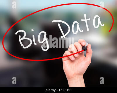 Man Hand writing Big Data with marker on transparent wipe board Stock Photo