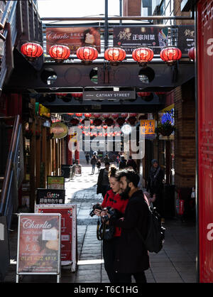 Birmingham, England - March 17 2019:   Chinese lanterns spread across the street in Chinatown's Arcadian Centre on Cathay Street Stock Photo