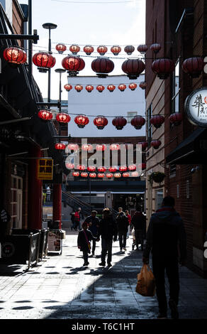 Birmingham, England - March 17 2019:   Chinese lanterns spread across the street in Chinatown's Arcadian Centre on Cathay Street Stock Photo