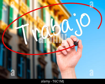 Man Hand writing Trabajo  ( work in Spanish) with black marker on visual screen Stock Photo