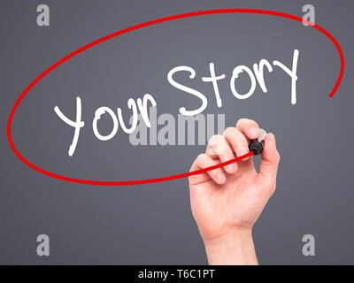 Man Hand writing Your Story with black marker on visual screen Stock Photo