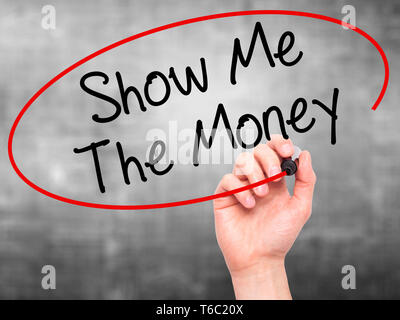 Man Hand writing Show Me The Money with black marker on visual screen Stock Photo
