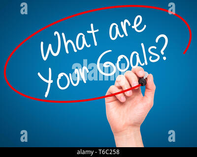 Man Hand writing What are Your Goals?  with black marker on visual screen Stock Photo