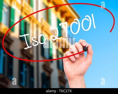 Man Hand writing Iso 27001  with black marker on visual screen Stock Photo