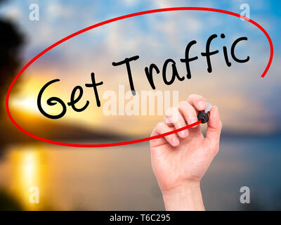 Man Hand writing Get Traffic with black marker on visual screen Stock Photo