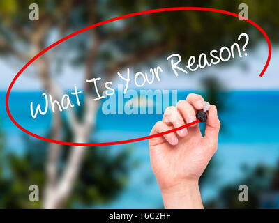 Man Hand writing What Is Your Reason? with black marker on visual screen Stock Photo