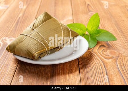 traditional Chinese ZongZi for dragon boat festival on wood table Stock Photo