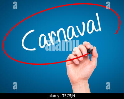 Man Hand writing Carnaval with black marker on visual screen Stock Photo