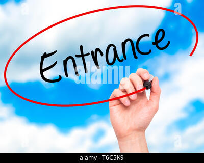 Man Hand writing Entrance with black marker on visual screen Stock Photo