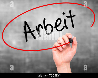 Man Hand writing Arbeit (Work in German) with black marker on visual screen Stock Photo
