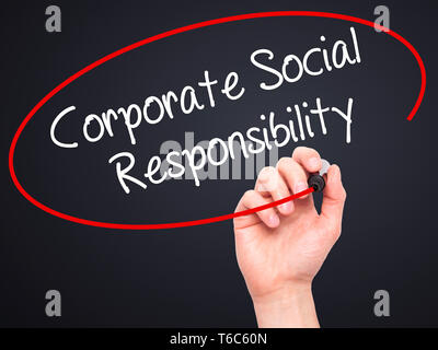 Man Hand writing Corporate Social Responsibility with black marker on visual screen. Stock Photo
