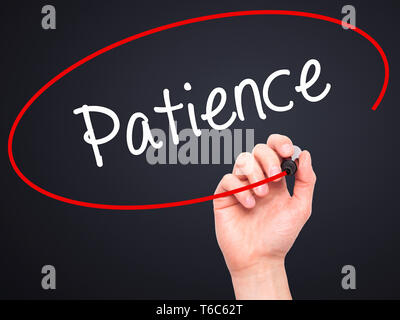 Man Hand writing Patience with black marker on visual screen. Isolated ...