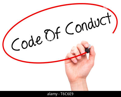 Man Hand writing Code Of Conduct with black marker on visual screen Stock Photo