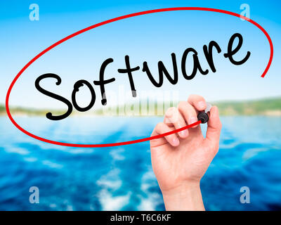 Man Hand writing Software  with black marker on visual screen. Stock Photo