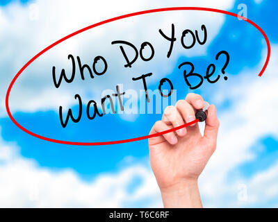 Man Hand writing Who Do You Want To Be? with black marker on visual screen Stock Photo