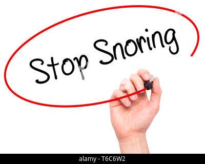 Man Hand writing Stop Snoring with black marker on visual screen Stock Photo