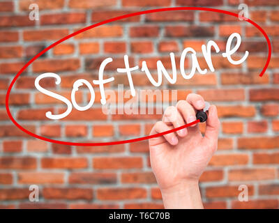 Man Hand writing Software  with black marker on visual screen. Stock Photo