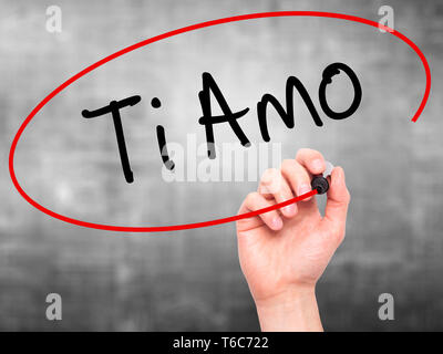 Man Hand writing Ti Amo (I Love You In Italian) with black marker on visual screen. Stock Photo