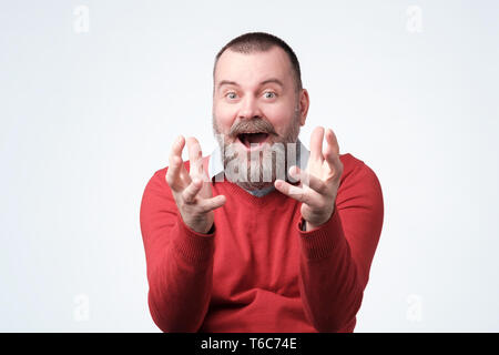 Mature bearded guy achieves big effective results Stock Photo