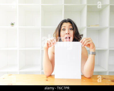 Attractive beautiful woman holding blank white paper. Stock Photo