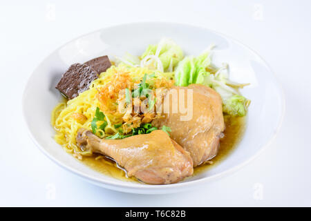 a plate of chicken and noodles soup with vegetables Stock Photo