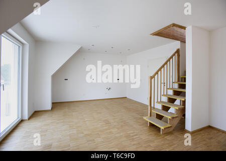 empty room with white walls in new built house in construction Stock Photo