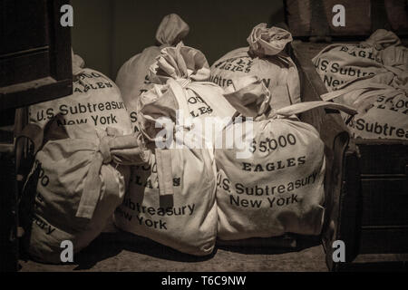 Old money bags on exhibit inside the Federal Hall. The Federal Hall was the first toll house in New York and also the site of the stock exchange before it moved across the street to where NYSE Euronext Stock Exchange is today. Stock Photo
