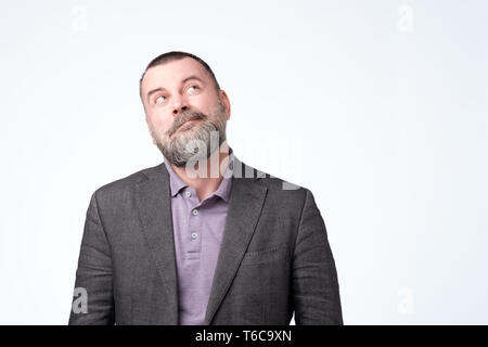 Mature caucasian man thinking about his life problem. Stock Photo