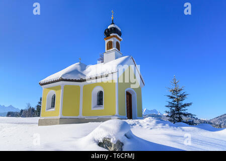 Beautiful chapel in wintry bavarian alps near Krün Stock Photo
