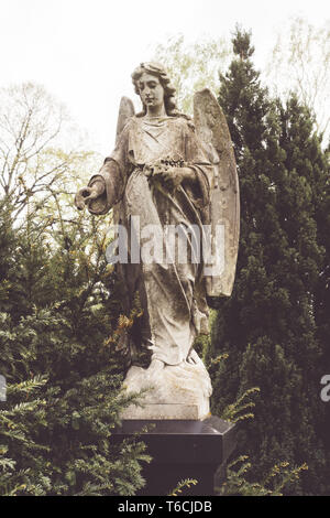 old sculpture of an angel in nature. Unknown artist of the 19th Stock ...