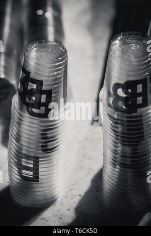 macro shot of plastic cups for degustation stacked on a table, switzerland Stock Photo