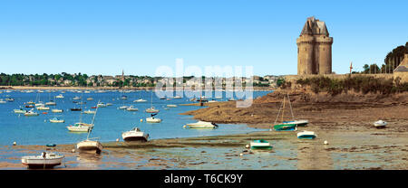 Beach with moored boats facing the Solidor tower in Brittany, France. Stock Photo