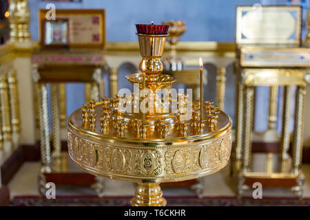 Burning candles in a church Stock Photo