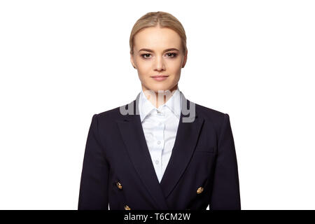 Studio portrait of young confident elegant businesswoman in a dark business suit. Stock Photo