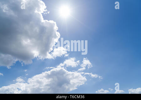 Cloudscape with blue sky and sun for backgrounds Stock Photo - Alamy