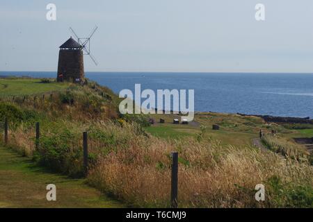 St Monans Windmill by the Old Salt Pans on a Calm Summers Day. Fife, Scotland, UK. Stock Photo