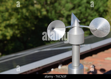 close up of aluminum anemometer on roof Stock Photo