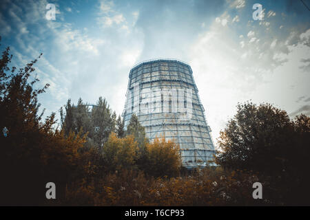 Large factory chimney of slate in a cloudy morning Stock Photo