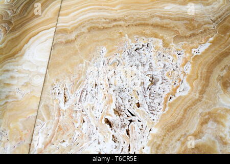 Beautiful onyx stone natural texture patterns, design wall, modern architecture, white, yellow and brown colors Stock Photo