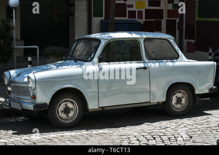 Blue vintage restored Trabant car on paved street Stock Photo
