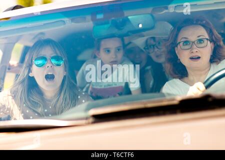 Mothers with daughters scared in car - frightened by incoming accident - fear behind the wheel Stock Photo