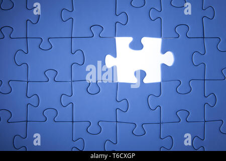Blue jigsaw puzzle. Business solutions, solving problems,science technology and team building concept. Stock Photo