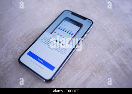 Close Up of Apple Iphone XS Space Gray Setup Screen with Screen Time Details Stock Photo